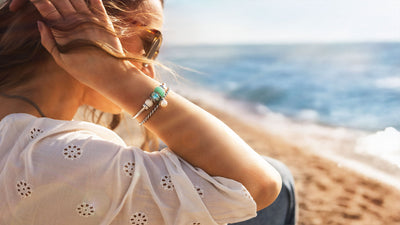 Model wears Trollbeads bracelet with beads from Tides of Treasure