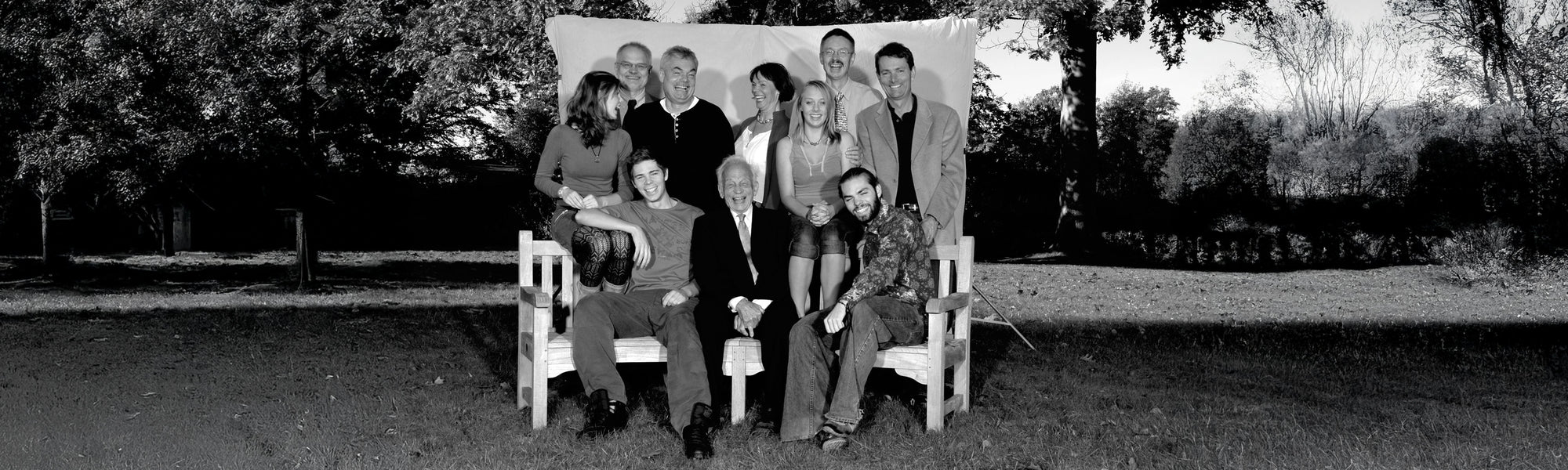 Black and white photo of the trollbeads family posing outdoors