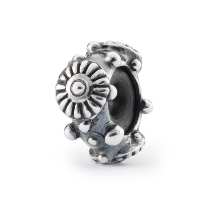 Daisy spacer is made of silver with a delicate daisy design and the core contains rubber to prevent beads from rolling of your bracelet.